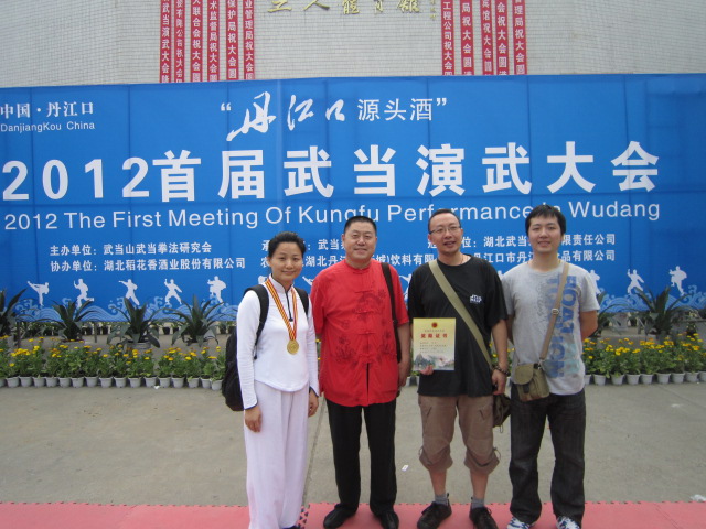 Mr. Liu Tiechen (in red shirt) and his students